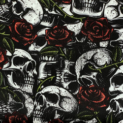 Coton imprimé têtes de mort et roses fond noir